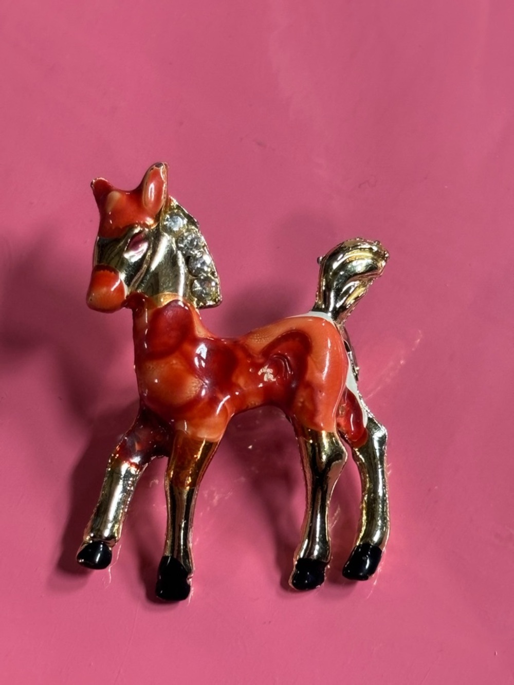 Enamelled Foal Brooch in Red and Gold